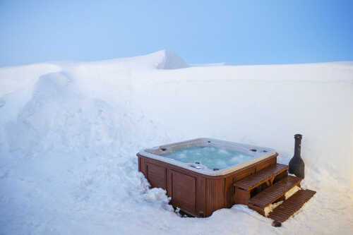 Whirlpool Jacuzzi with snow all around.